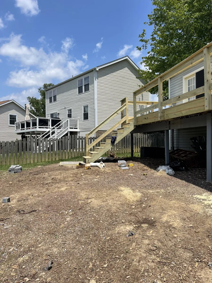 Rebuilt pressure-treated wood deck with newly framed railings