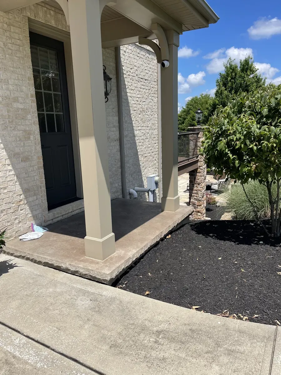 Finished front porch columns after cleaning and new caulking